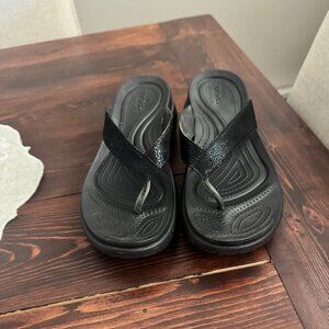 Crocs Flip Flops - Size W9 - Black